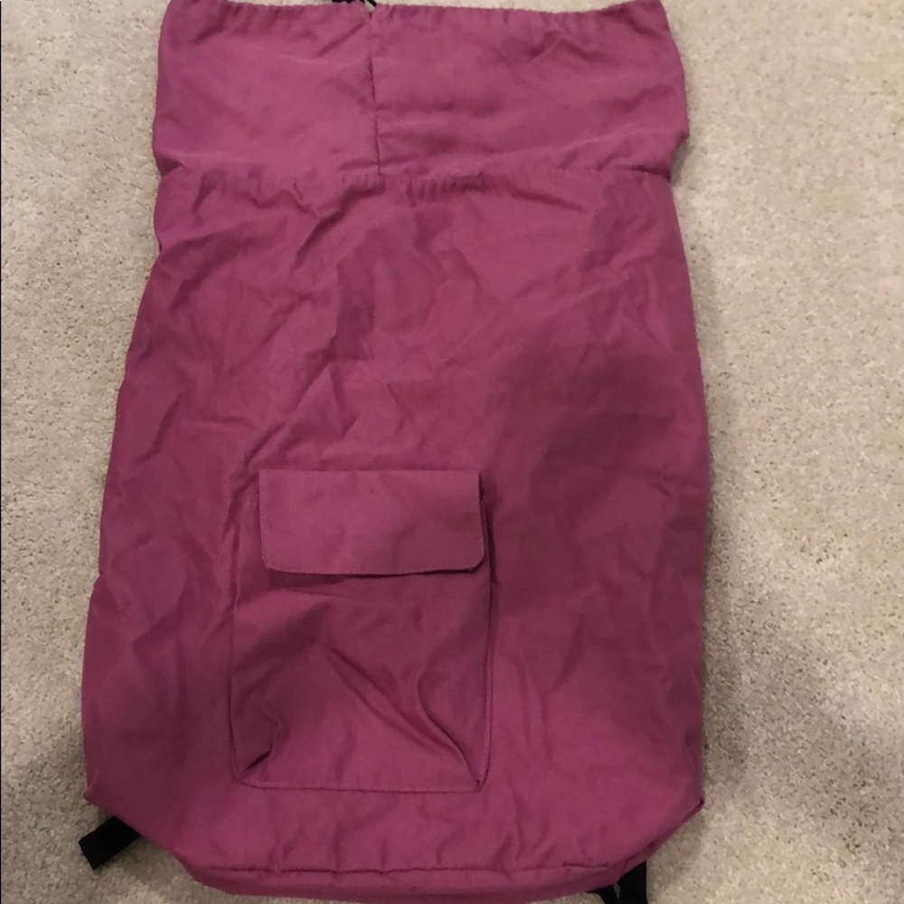 Backpack laundry bag with pocket
